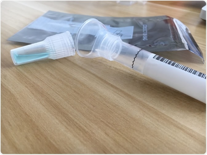 DNA testing kit. Image Credit: Sarah Weldon / Shutterstock