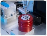 chameleon’s tweezer picking up a foil grid for protein sample-prep