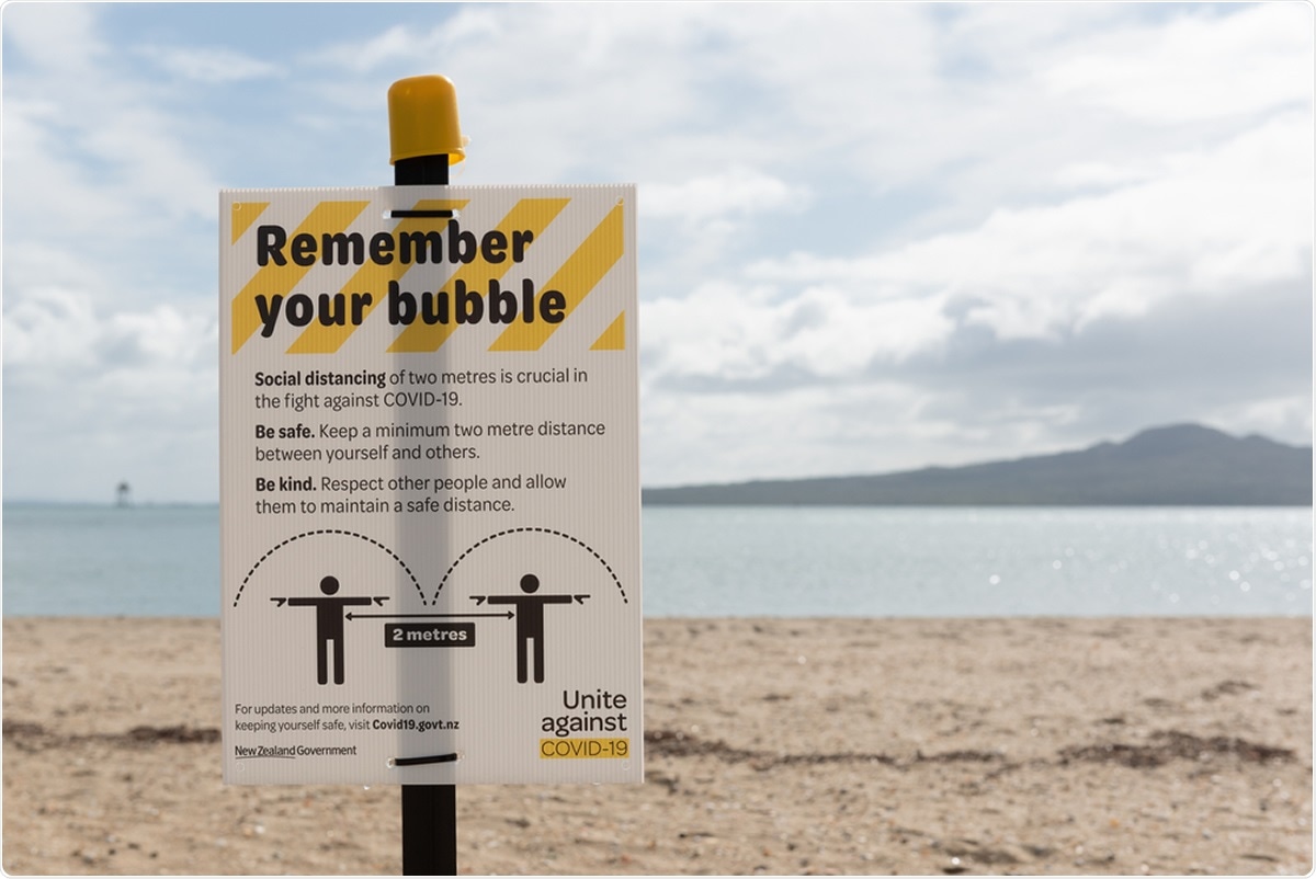 Mission Bay, Auckland / New Zealand - April 16 2020: Warning sign on Mission Bay beach reminding people to maintain 2 metres of social distancing during the coronavirus/covid-19 pandemic lockdown. Image Credit: Steve Todd / Shutterstock