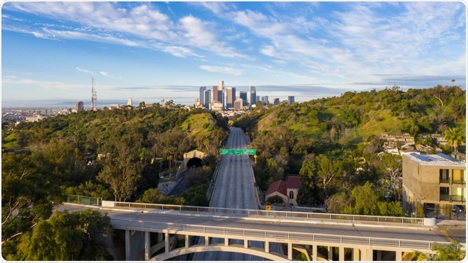 Aerial view of empty freeway streets with no people in downtown Los Angeles California as result of coronavirus pandemic or COVID-19 virus outbreak and lockdown. Image Credit: Hyperlapse Media / Shutterstock