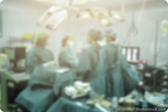 Blur of Surgeons team working with Monitoring of patient in surgical operating room background. success with operating room, medical concept