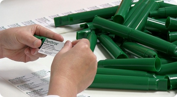 Penthrox label being applied to green whistle