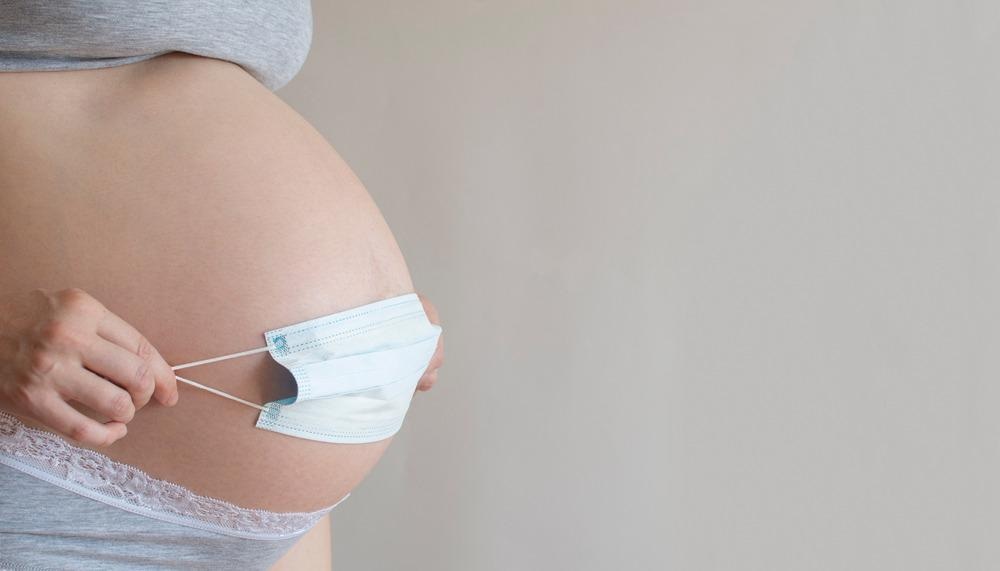 Pregnant women with face mask