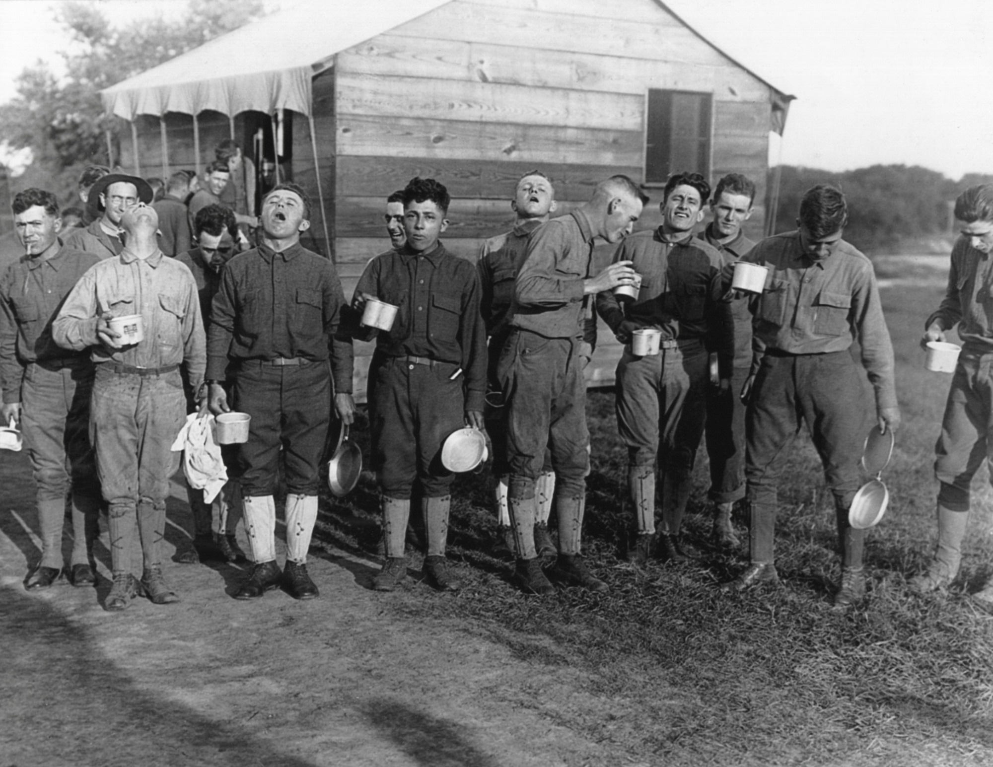 Soldiers gargle with salt and water to prevent influenza. Sept. 24, 1918. Camp Dix, New Jersey, during the 1918-19
