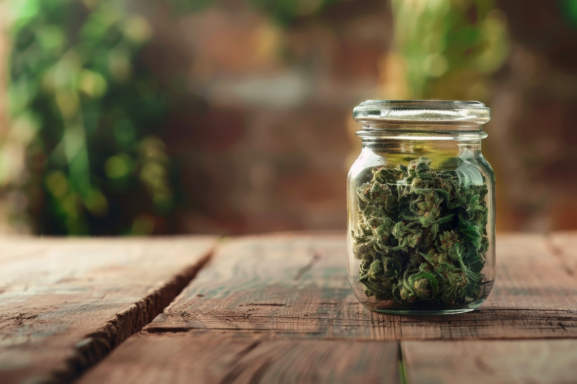 Medical cannabis buds in a glass jar.